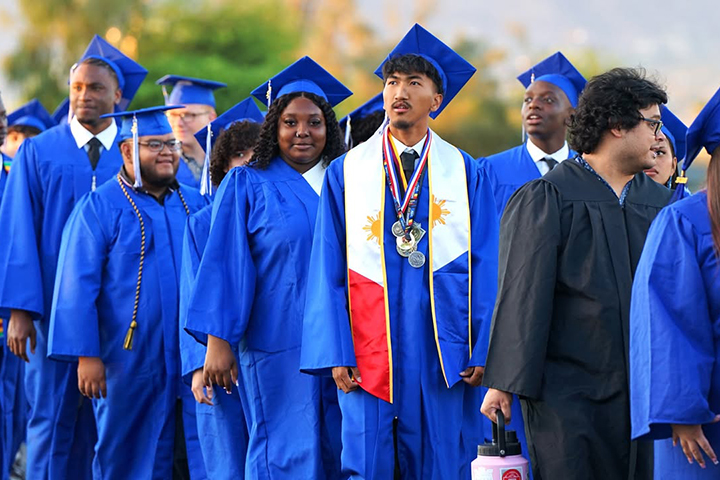 Graduates file onto the field