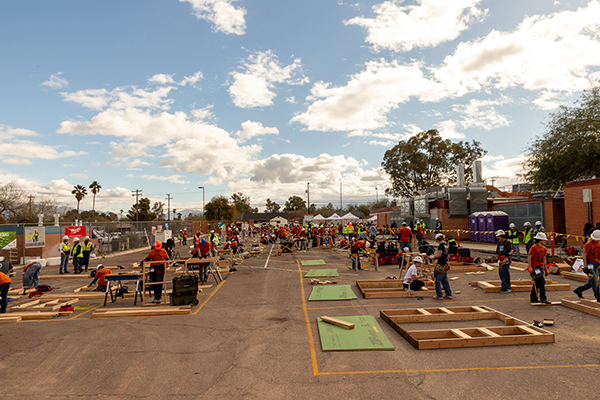 Students work on construction projects in the parking lot