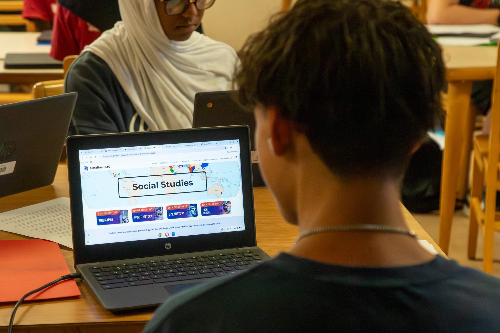 Students work on their laptops