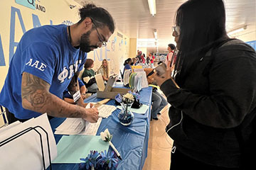 A Catalina High School student gets checked in during the first day of school, August 3, 2023.