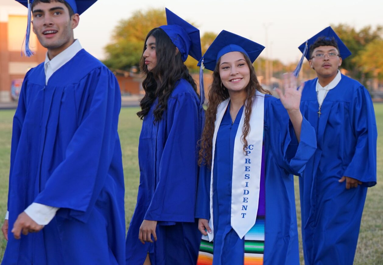 Catalina grads smile while walking into the stadium before the ceremony
